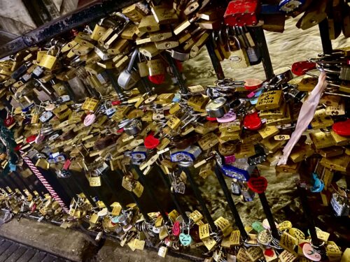 Hundreds of brass, pink, and red love locks adorn gates throughout the city of Helen, Georgia