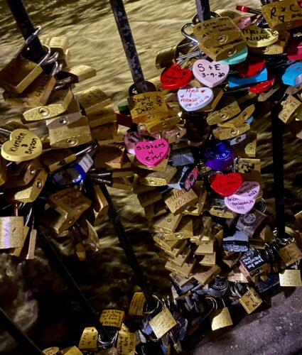 Hundreds of brass, pink, and red love locks adorn gates throughout the city of Helen, Georgia